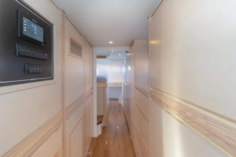 Ohana 8 Yacht Photos Pics Interior hallway of 2020 Balance 526 yacht, featuring modern design and control panel.