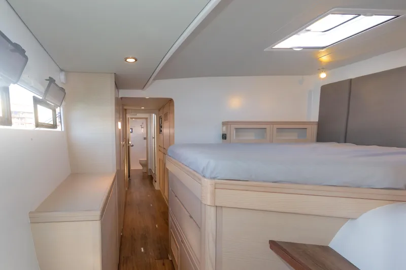 Ohana 8 Yacht Photos Pics Modern interior of 2020 Balance 526 yacht with cozy bedroom and wooden flooring.