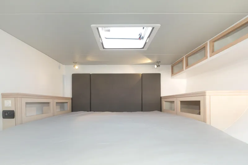 Ohana 8 Yacht Photos Pics Modern interior of Balance 526 yacht, 2020 model, featuring a skylight and sleek storage.