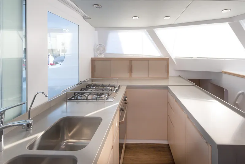 Ohana 8 Yacht Photos Pics Modern kitchen interior on Balance 526 yacht, featuring stainless steel appliances and ample natural light.