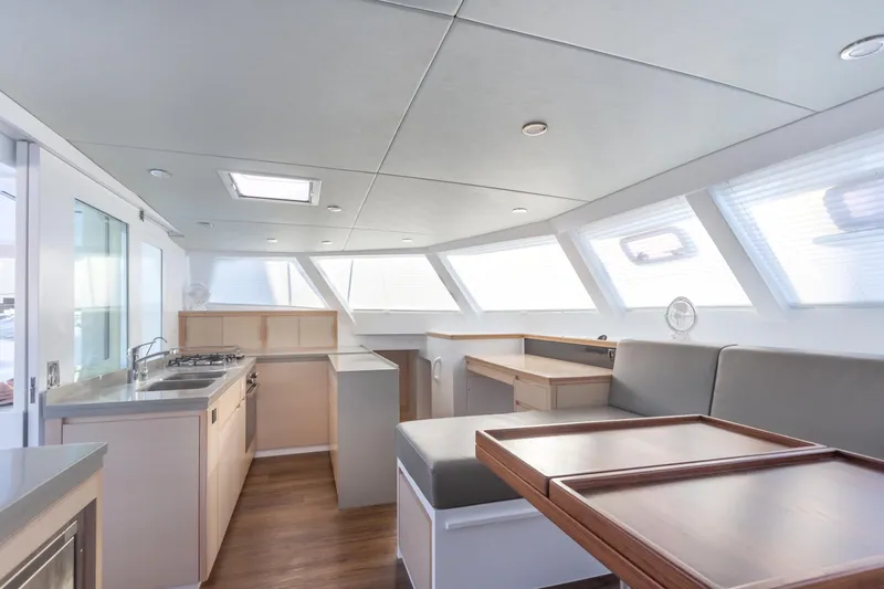 Ohana 8 Yacht Photos Pics Modern interior of 2020 Balance 526 yacht with kitchen and seating area.