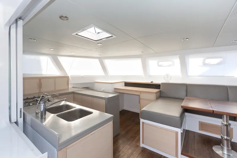 Ohana 8 Yacht Photos Pics Modern interior of 2020 Balance 526 yacht with sleek kitchen and seating area.
