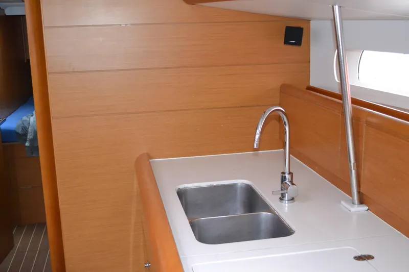 1305 Yacht Photos Pics Interior of 2013 Jeanneau Sun Odyssey 509 yacht, featuring a modern kitchen sink.