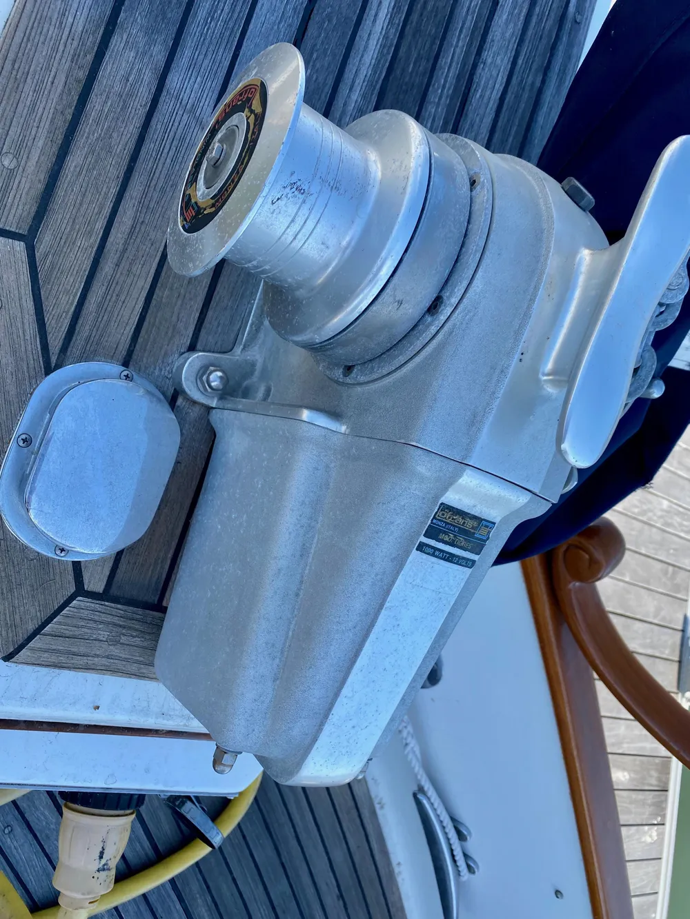 1997 Grand Banks Classic boat winch on wooden deck.