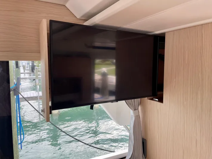  Yacht Photos Pics Flat-screen TV inside 2026 Beneteau Swift Trawler 41, near water view.
