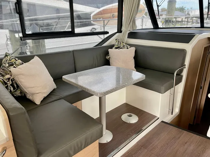  Yacht Photos Pics 2026 Beneteau Swift Trawler 41 interior with cozy seating and table.