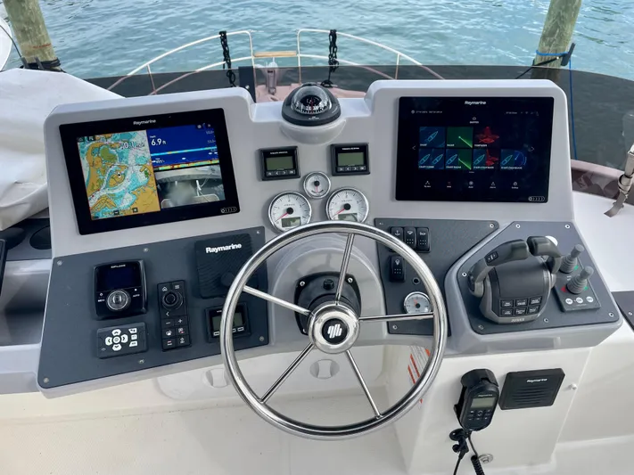  Yacht Photos Pics Helm of 2026 Beneteau Swift Trawler 41 with navigation screens and controls.