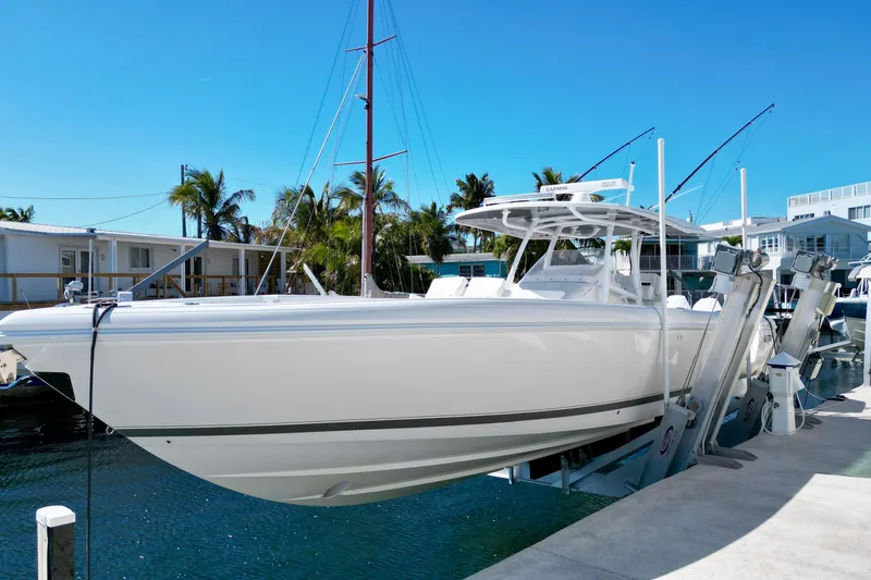  Yacht Photos Pics 2024 Intrepid 407 Nomad FE boat docked under clear blue sky.