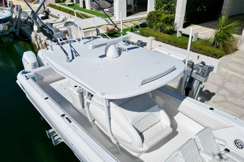  Yacht Photos Pics 2024 Intrepid 407 Nomad FE boat docked, featuring sleek design and advanced equipment.