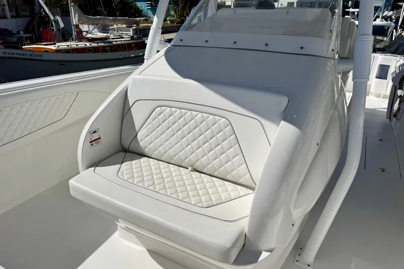  Yacht Photos Pics 2024 Intrepid 407 Nomad FE boat with white quilted seating detail.