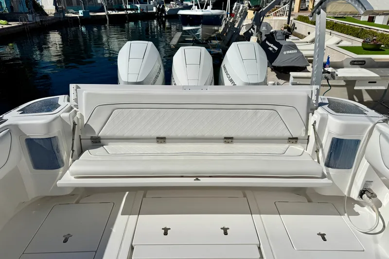  Yacht Photos Pics 2024 Intrepid 407 Nomad FE boat with triple Mercury engines at a marina.