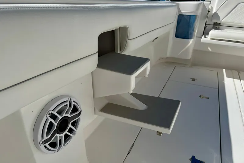  Yacht Photos Pics 2024 Intrepid 407 Nomad FE boat interior with speaker and foldable table.