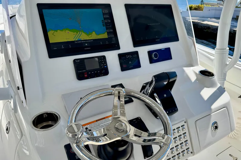  Yacht Photos Pics 2024 Intrepid 407 Nomad FE helm with advanced navigation displays and controls.