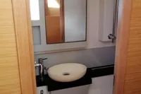 Bathroom interior of 2018 Nautitech 40 Open catamaran with modern sink and mirror.