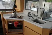 Modern kitchen in 2018 Nautitech 40 Open yacht with stove, sink, and oven.