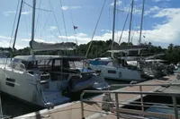 Docked Nautitech 40 Open catamarans, 2018 model, under clear blue sky.