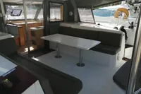 Spacious interior of 2018 Nautitech 40 Open catamaran with modern seating and dining area.