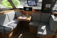 Interior of 2018 Nautitech 40 Open catamaran with cozy seating and table setup.