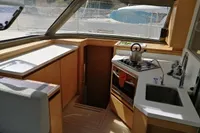 Modern kitchen interior of 2018 Nautitech 40 Open catamaran with stove, sink, and cabinetry.