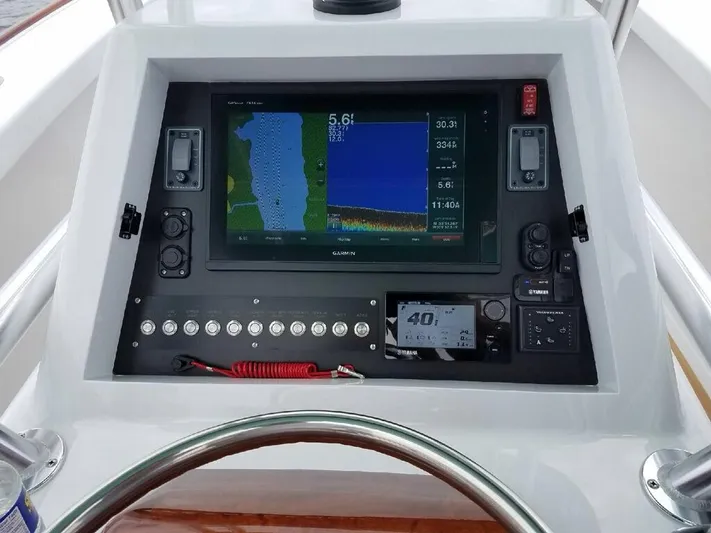 Drift Wood Yacht Photos Pics 2017 Custom Carolina 28 CC Harrison Boatworks dashboard with navigation display and controls.