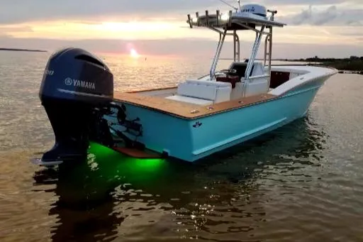 Drift Wood Yacht Photos Pics Custom Carolina 28 CC Harrison Boatworks 2017 at sunset with Yamaha engine and green underwater lights.
