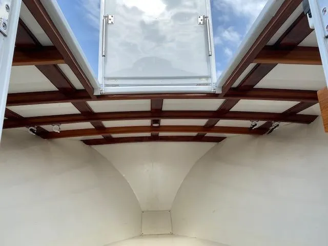 Drift Wood Yacht Photos Pics Interior view of 2017 Custom Carolina 28 CC Harrison Boatworks, featuring wooden ceiling details.