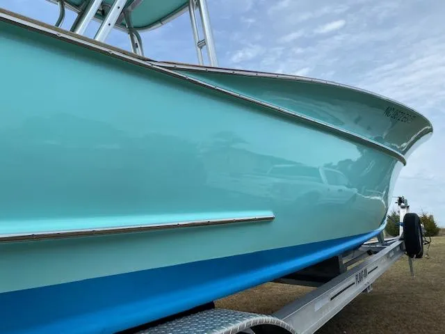 Drift Wood Yacht Photos Pics 2017 Custom Carolina 28 CC Harrison Boatworks on trailer, light blue hull, clear sky background.