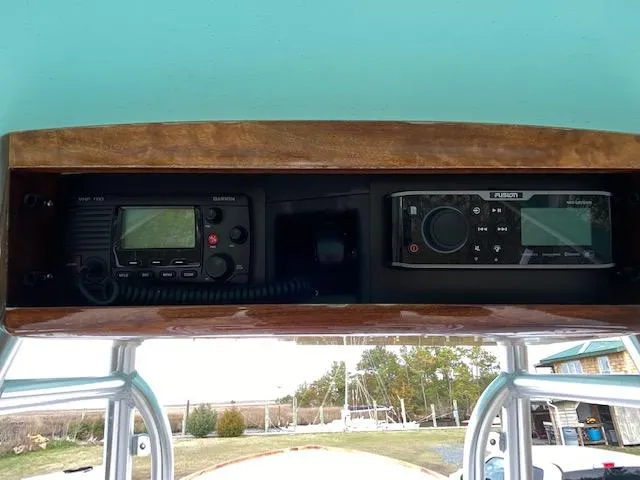 Drift Wood Yacht Photos Pics 2017 Custom Carolina 28 CC Harrison Boatworks dashboard with radio and navigation equipment.