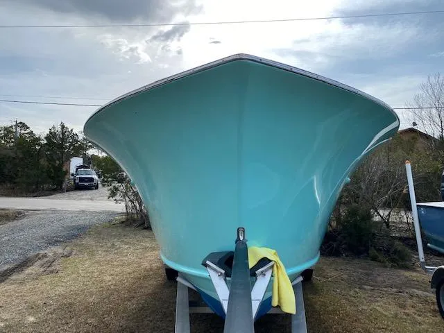 Drift Wood Yacht Photos Pics 2017 Custom Carolina 28 CC Harrison Boatworks, turquoise hull, on trailer, front view.