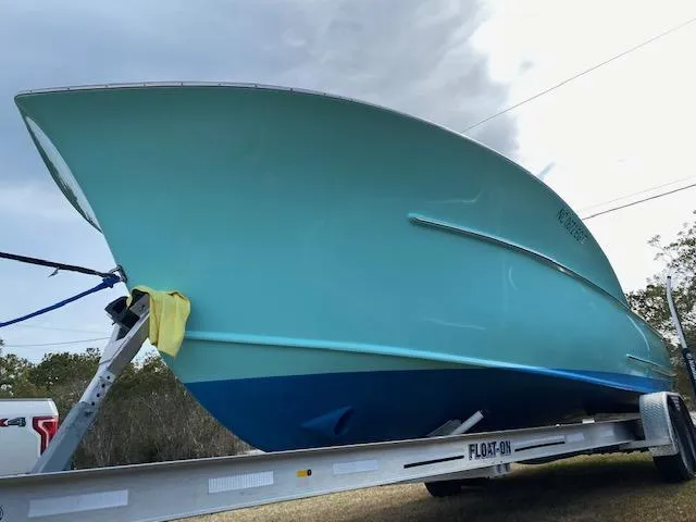 Drift Wood Yacht Photos Pics Custom Carolina 28 CC Harrison Boatworks 2017 on trailer, sky background.