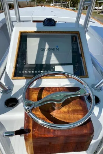 Drift Wood Yacht Photos Pics 2017 Custom Carolina 28 CC boat helm with Garmin display and wooden steering wheel.