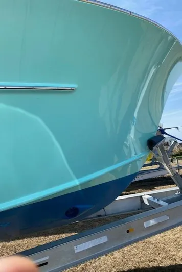 Drift Wood Yacht Photos Pics 2017 Custom Carolina 28 CC Harrison Boatworks, turquoise hull on trailer.