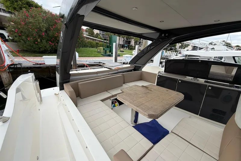  Yacht Photos Pics Luxurious interior of 2019 Absolute 40 SLT yacht with seating and table.