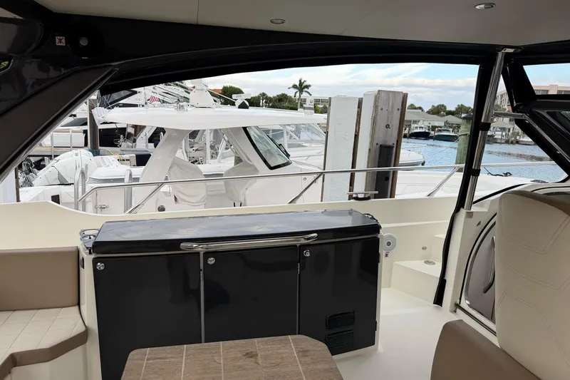  Yacht Photos Pics Interior view of 2019 Absolute 40 SLT yacht with marina background.