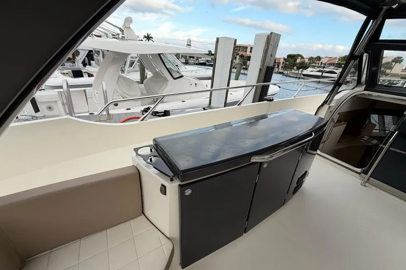  Yacht Photos Pics 2019 Absolute 40 SLT yacht interior with sleek cabinetry and marina view.
