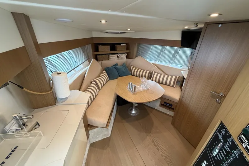  Yacht Photos Pics Luxurious interior of 2019 Absolute 40 SLT yacht with cozy seating and modern amenities.