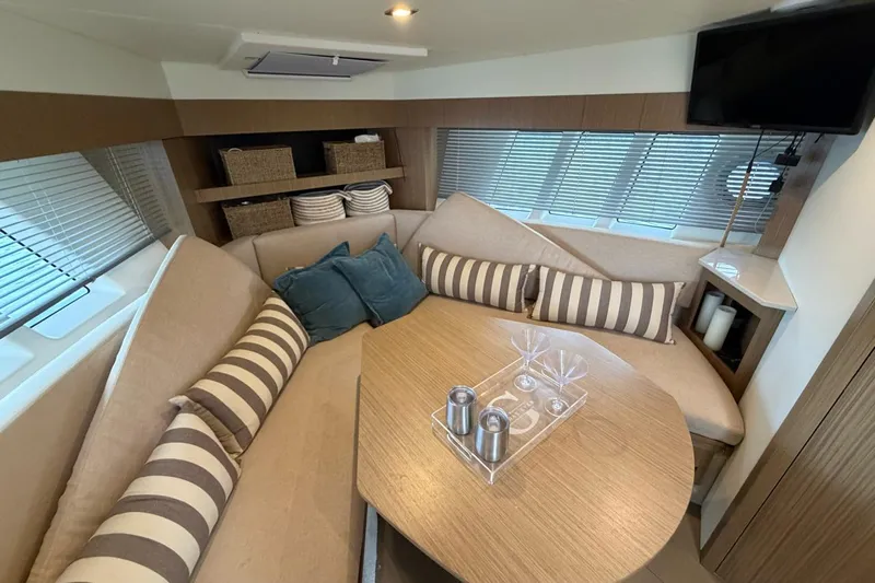  Yacht Photos Pics Luxurious interior of 2019 Absolute 40 SLT yacht with cozy seating and modern decor.