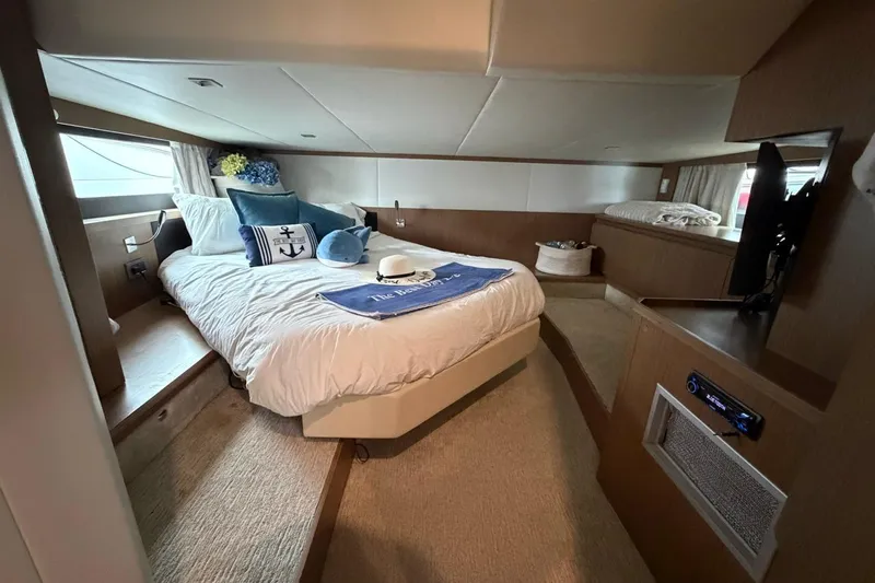  Yacht Photos Pics Luxurious cabin interior of 2019 Absolute 40 SLT yacht with cozy bed and decor.