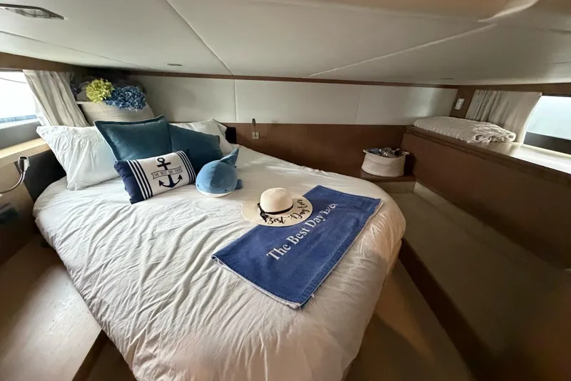  Yacht Photos Pics Luxurious bedroom interior of 2019 Absolute 40 SLT yacht with nautical decor.