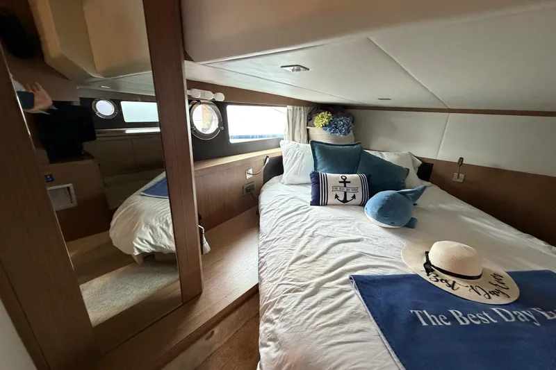  Yacht Photos Pics Luxurious cabin interior of 2019 Absolute 40 SLT yacht with nautical decor.