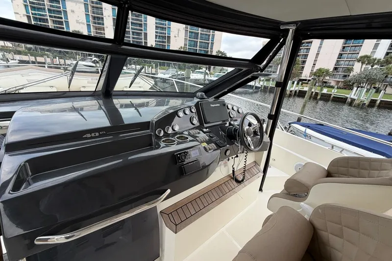  Yacht Photos Pics 2019 Absolute 40 SLT yacht helm with modern controls and luxurious seating.