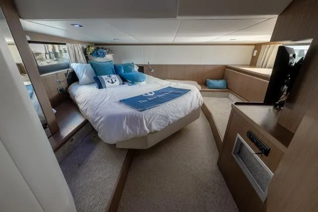  Yacht Photos Pics Luxurious cabin interior of 2019 Absolute 40 SLT yacht with cozy bedding and modern decor.