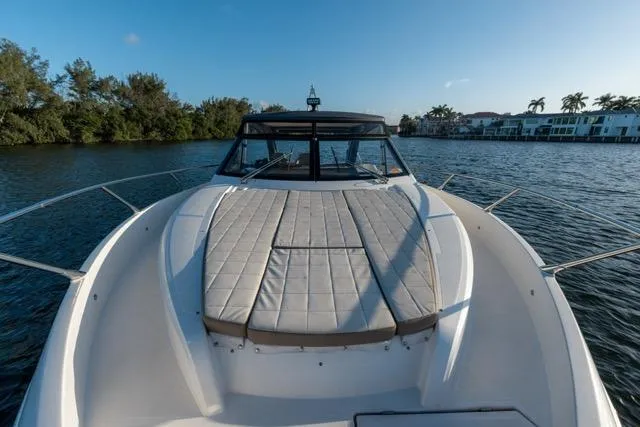  Yacht Photos Pics 2019 Absolute 40 SLT yacht on calm water, featuring spacious deck and sleek design.