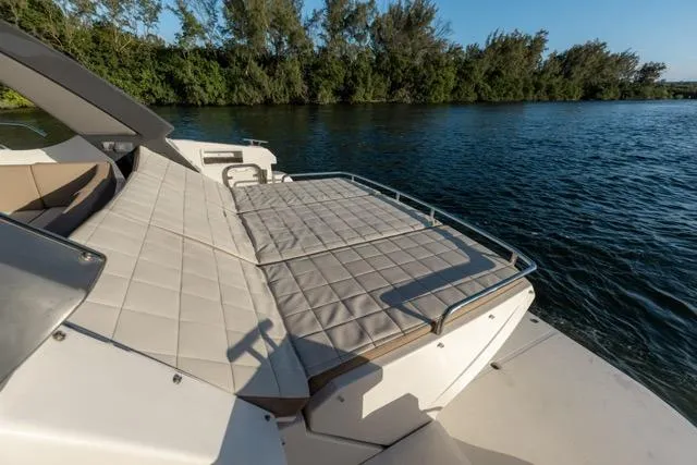  Yacht Photos Pics Luxurious 2019 Absolute 40 SLT yacht with spacious sunbathing deck by the water.