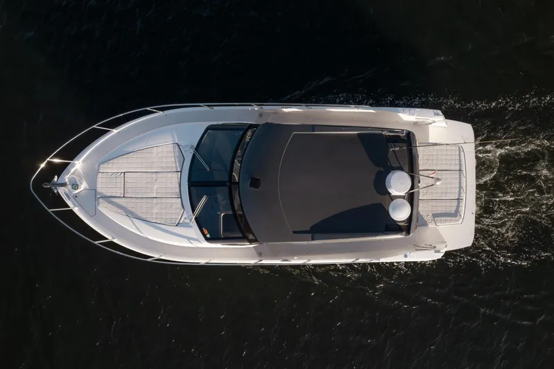  Yacht Photos Pics Aerial view of 2019 Absolute 40 SLT yacht cruising on dark water.