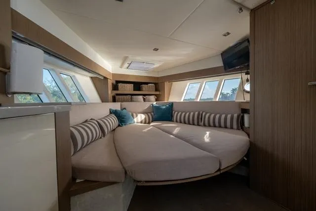  Yacht Photos Pics Luxurious interior of 2019 Absolute 40 SLT yacht with circular seating and modern decor.