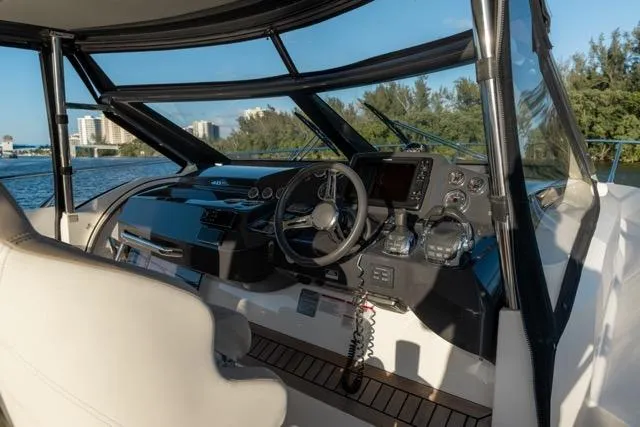  Yacht Photos Pics Cockpit of 2019 Absolute 40 SLT yacht with modern controls and scenic water view.