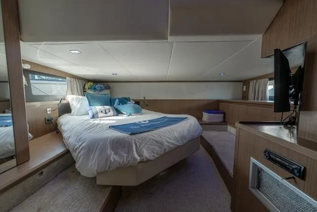  Yacht Photos Pics Luxurious bedroom interior of 2019 Absolute 40 SLT yacht with modern amenities.
