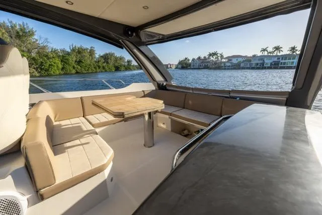  Yacht Photos Pics Luxurious 2019 Absolute 40 SLT yacht interior with elegant seating and scenic waterfront view.