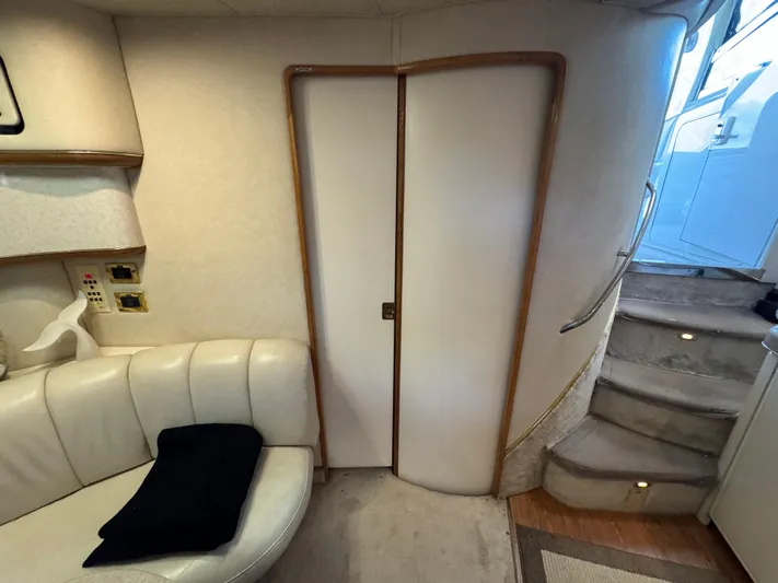 Salad Yacht Photos Pics Interior of 1997 Sea Ray 450 Sundancer with stairs and seating area.